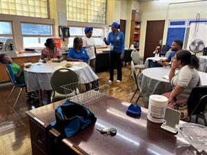  Ms. Evans, staff members, and families that attended the September Chat & Chew meeting